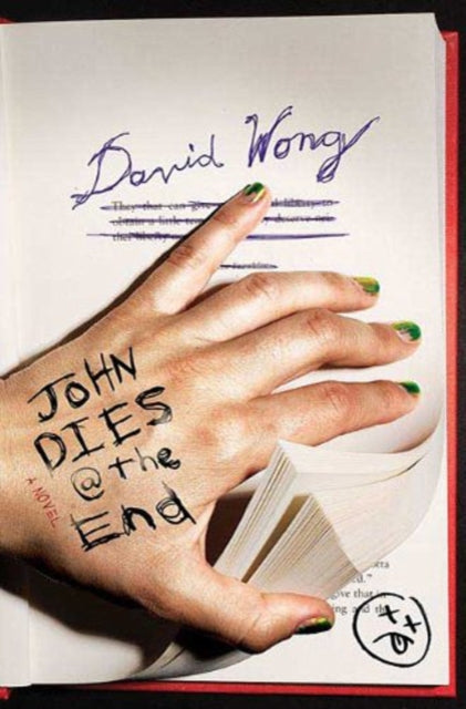 A hand with "John Dies at the End" written on it holds a book open.