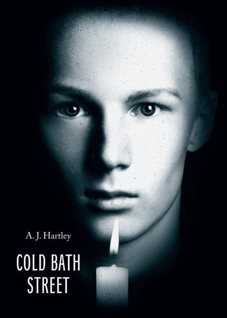 A book cover featuring a close-up of a young man's face with a lit candle.