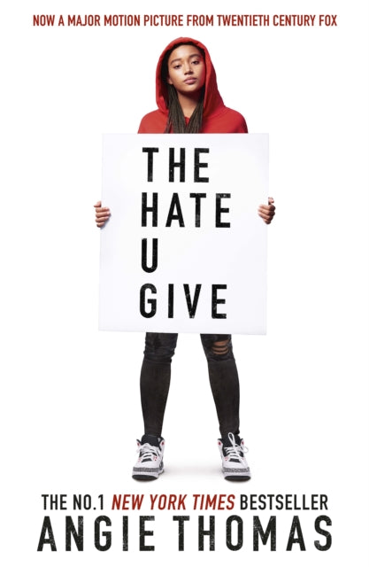 The Hate U Give movie tie-in edition book cover featuring a young woman holding a sign.
