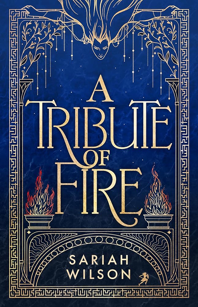 A Tribute of Fire book cover with gold lettering and flames on a blue background.