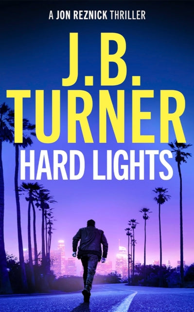 Book cover for "Hard Lights" by J.B. Turner, featuring a man walking away from the viewer towards a city skyline.