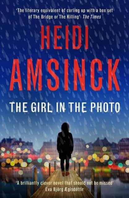 The Girl in the Photo book cover with a person on a pier at night.