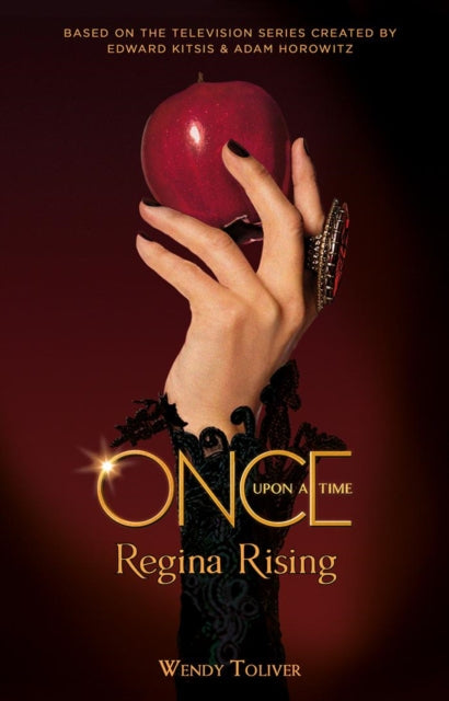 Book cover for Once Upon a Time Regina Rising featuring a hand holding a red apple.