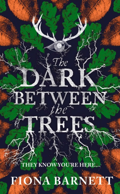 The Dark Between The Trees book cover with an eye and antlers.