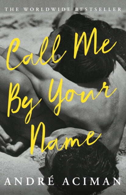 Call Me By Your Name book cover with yellow text on a black and white image of two people.