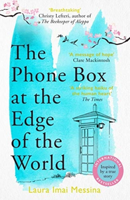 The Phone Box at the Edge of the World book cover with a phone booth and cherry blossoms.