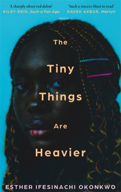 The Tiny Things Are Heavier book cover featuring a woman's face.