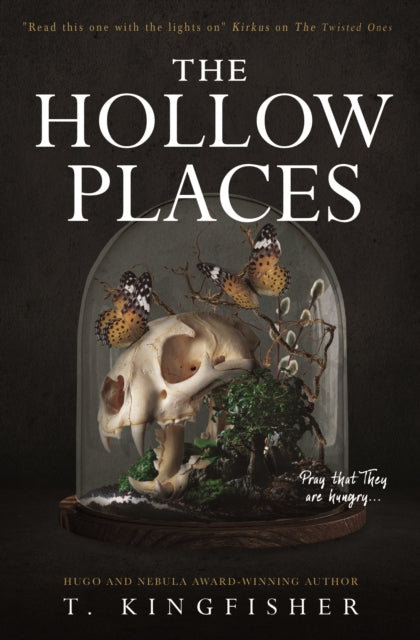 The Hollow Places book cover with a skull and butterflies under a glass dome.