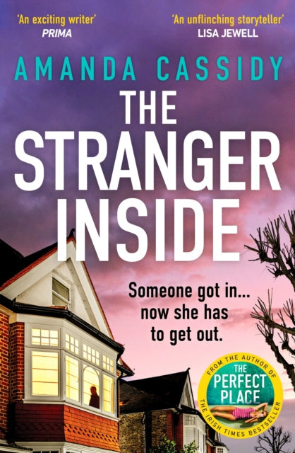 The Stranger Inside book cover featuring a house and dramatic sky.