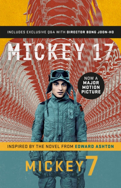 Mickey 17 official movie edition book cover with a man in a suit.
