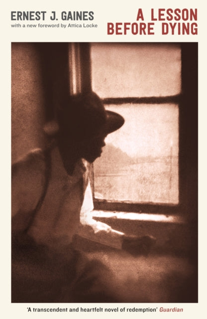 A Lesson Before Dying book cover with a sepia-toned image of a man looking out a window.