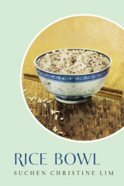 A bowl of rice with chopsticks on a wooden surface.