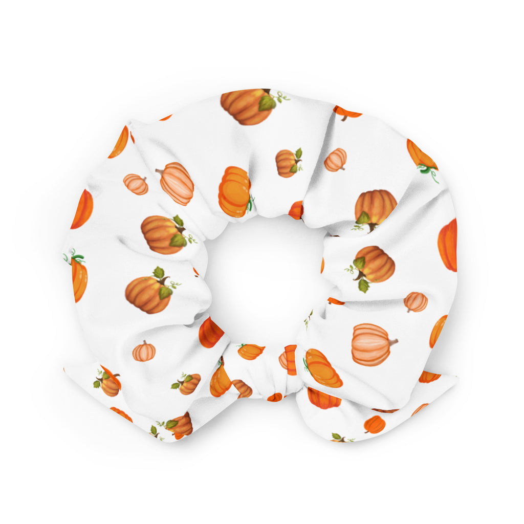 A white scrunchie with a pattern of orange pumpkins.