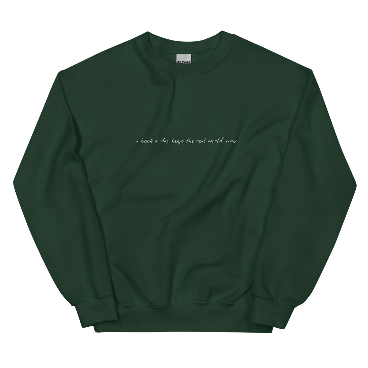 A dark green sweatshirt with the text "a book a day keeps the real world away"