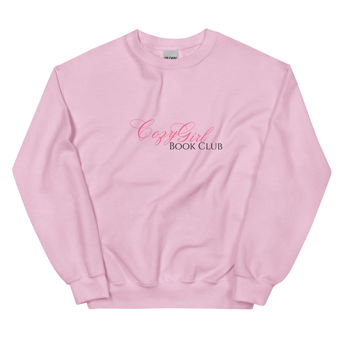 A pink Gildan sweatshirt with "Cozy Girl Book Club" printed in pink script.