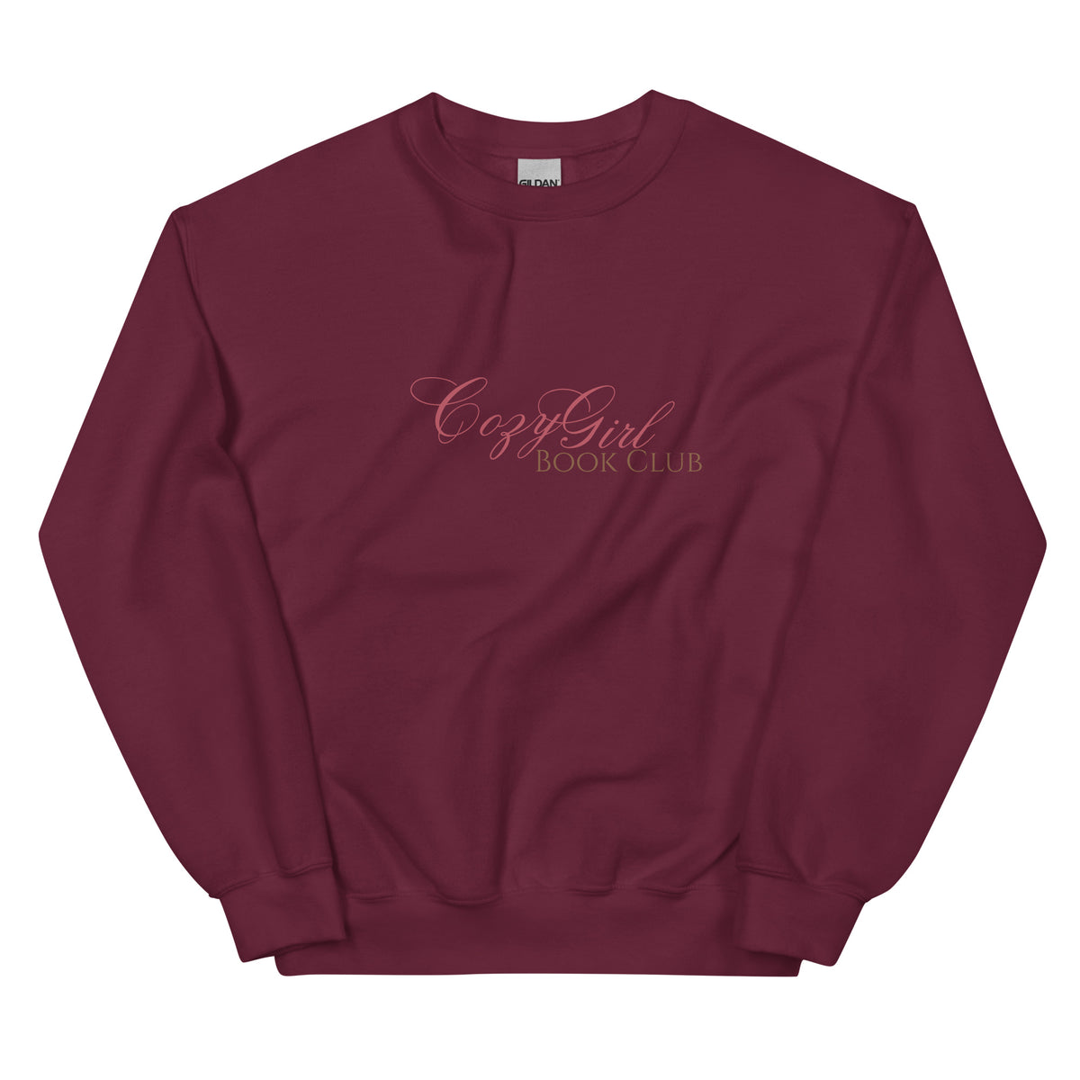 Maroon sweatshirt with "Cozy Girl Book Club" embroidered in pink.