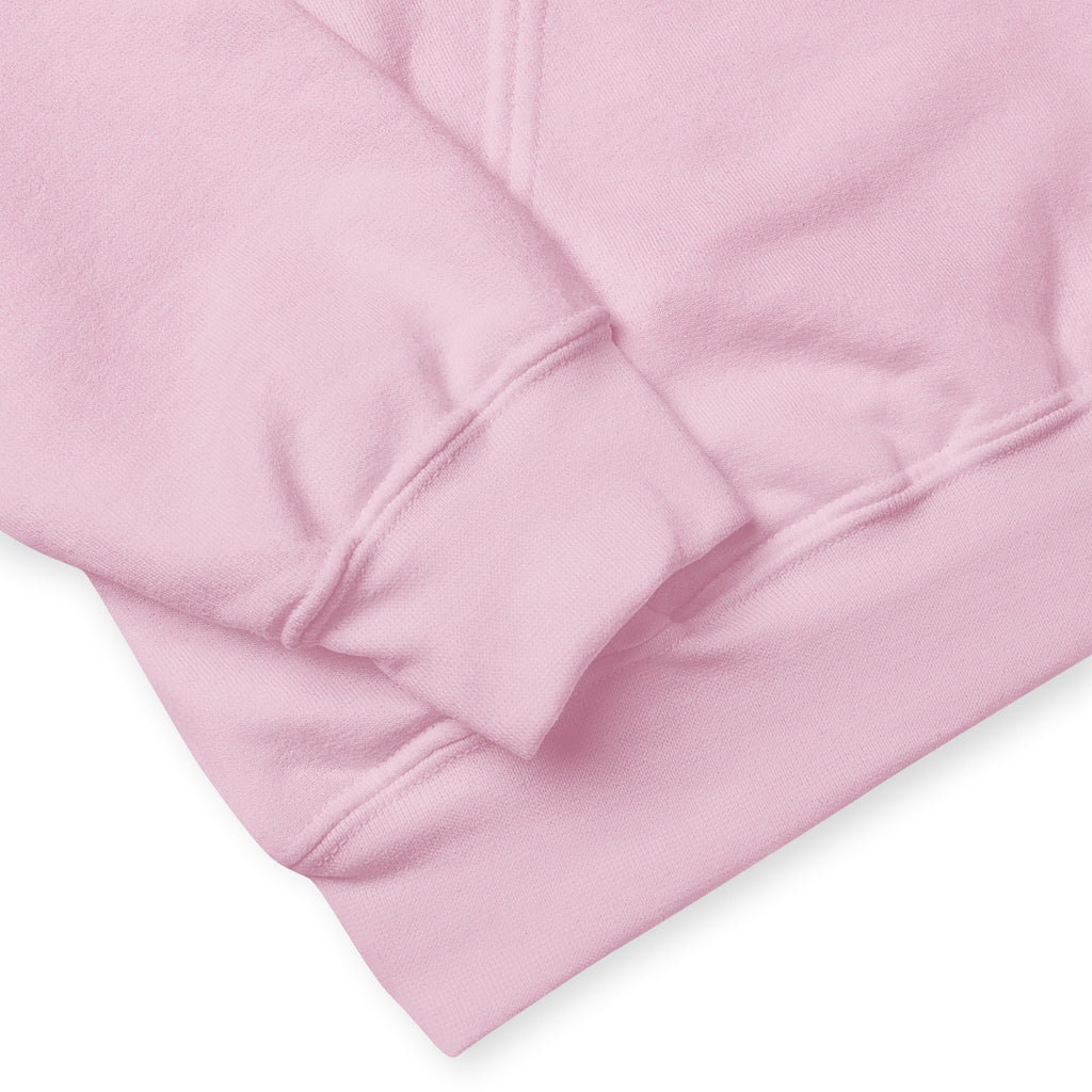 A close-up of a pink hoodie sleeve and hem.