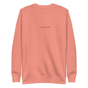 Peach sweatshirt with a small embroidered chili pepper design and text.