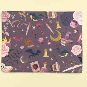 Romantasy bookish wrapping sheets with a magical pattern of dragons, roses, and spell books.