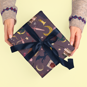 Romantasy bookish wrapping sheets with a dark, patterned design and navy ribbon.